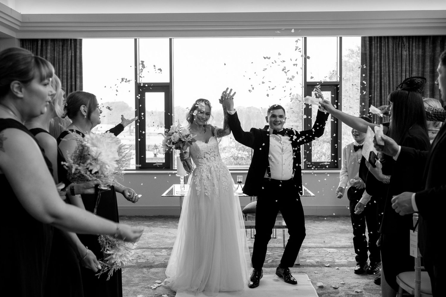 Newlyweds walking back down the aisle smiling