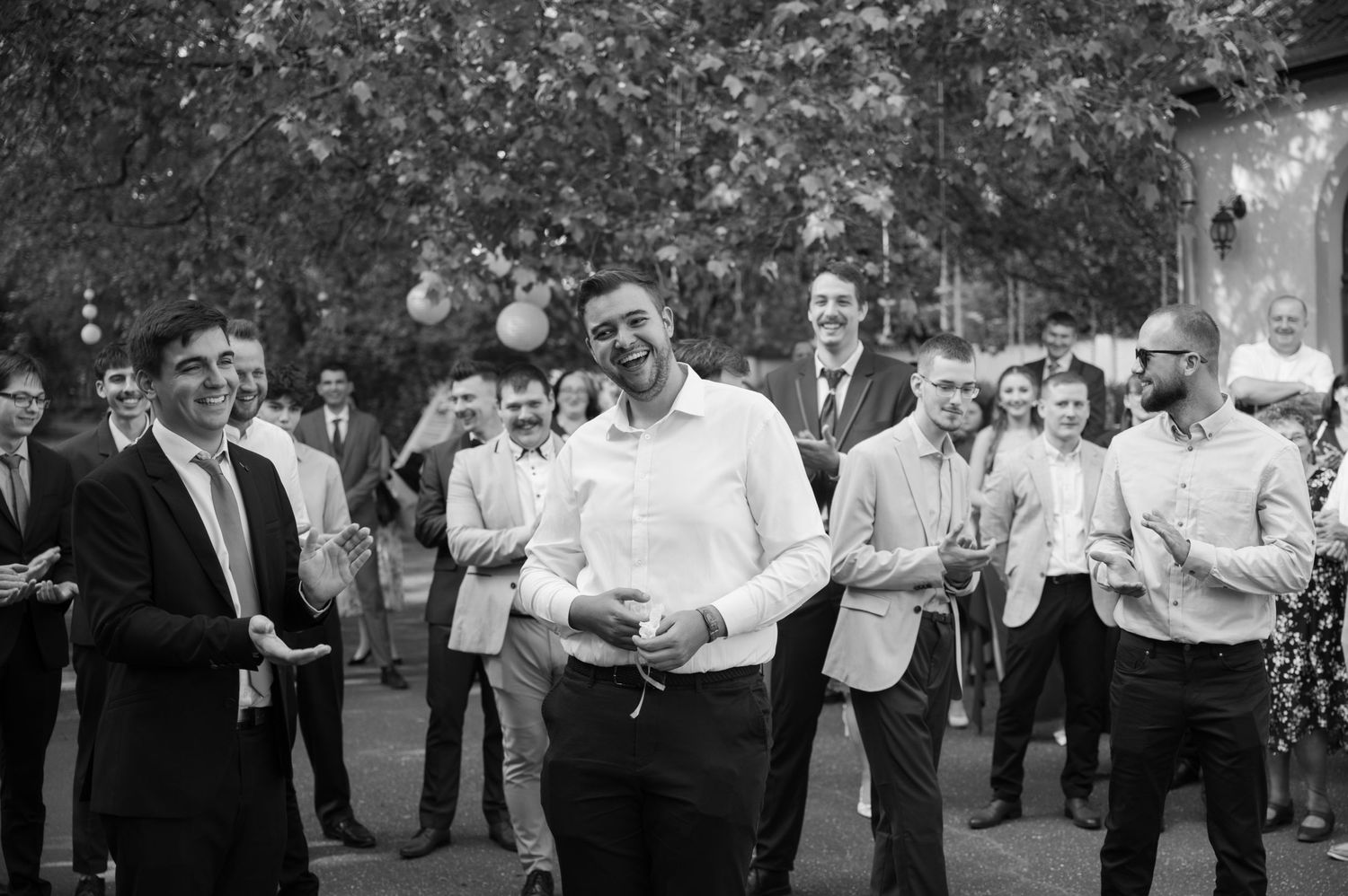Wedding guests mingling and socializing at an outdoor reception.