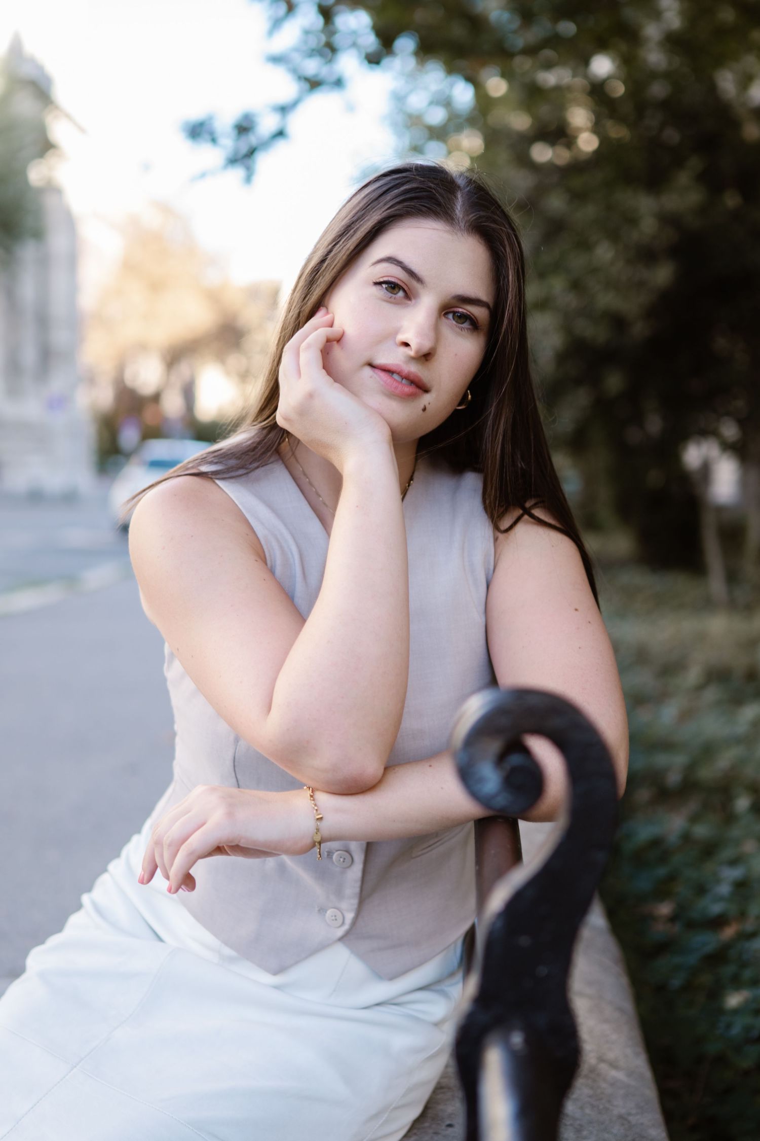 A series of outdoor portrait photos showing a person in a light colored sleeveless top posing against a natural background.