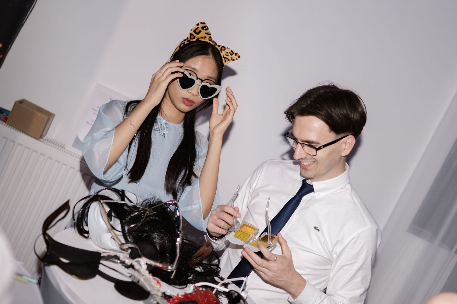 Party guests enjoying candid moments at a celebratory event.