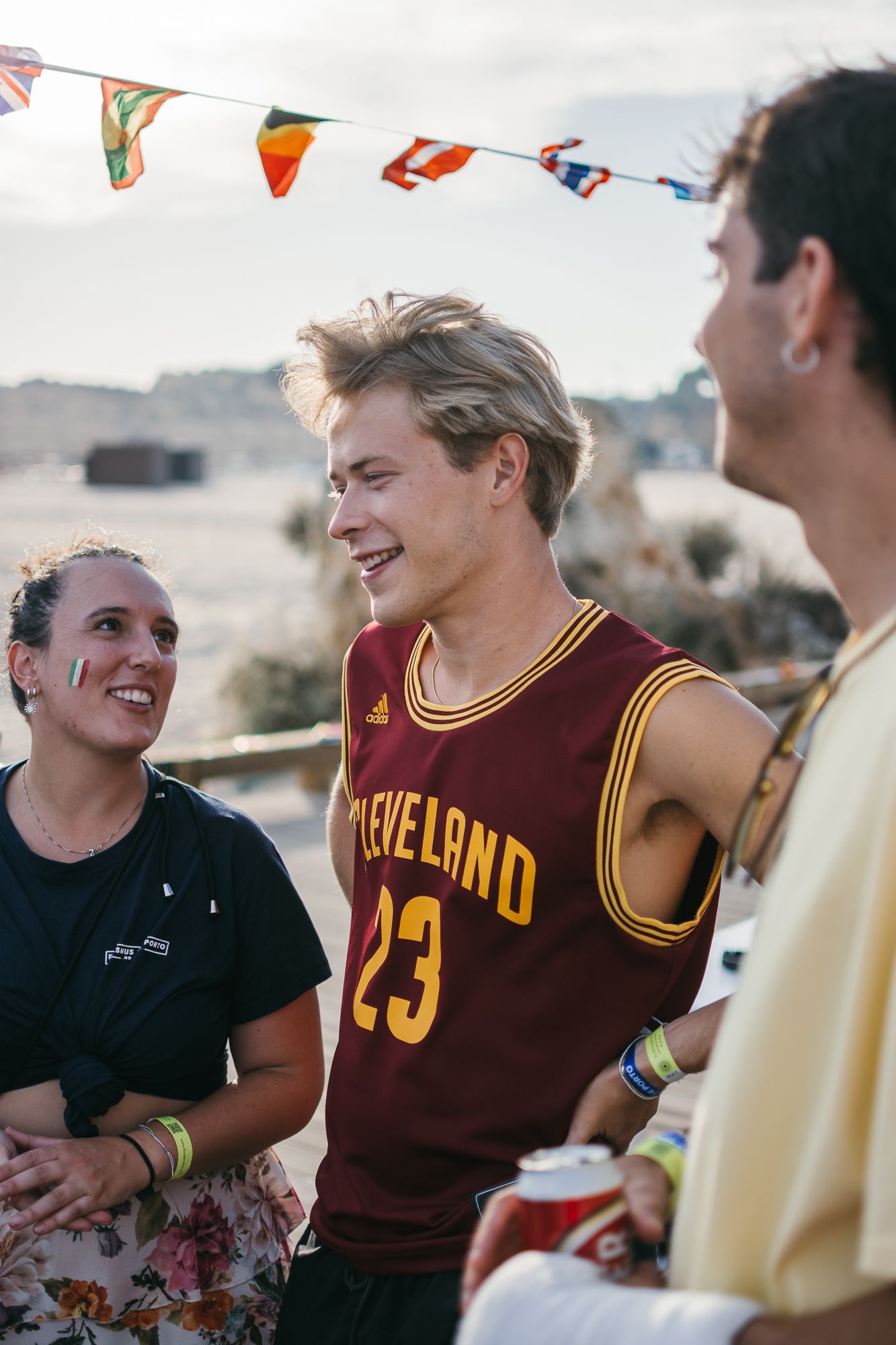 Group enjoying a casual gathering wearing sports jerseys and casual attire.