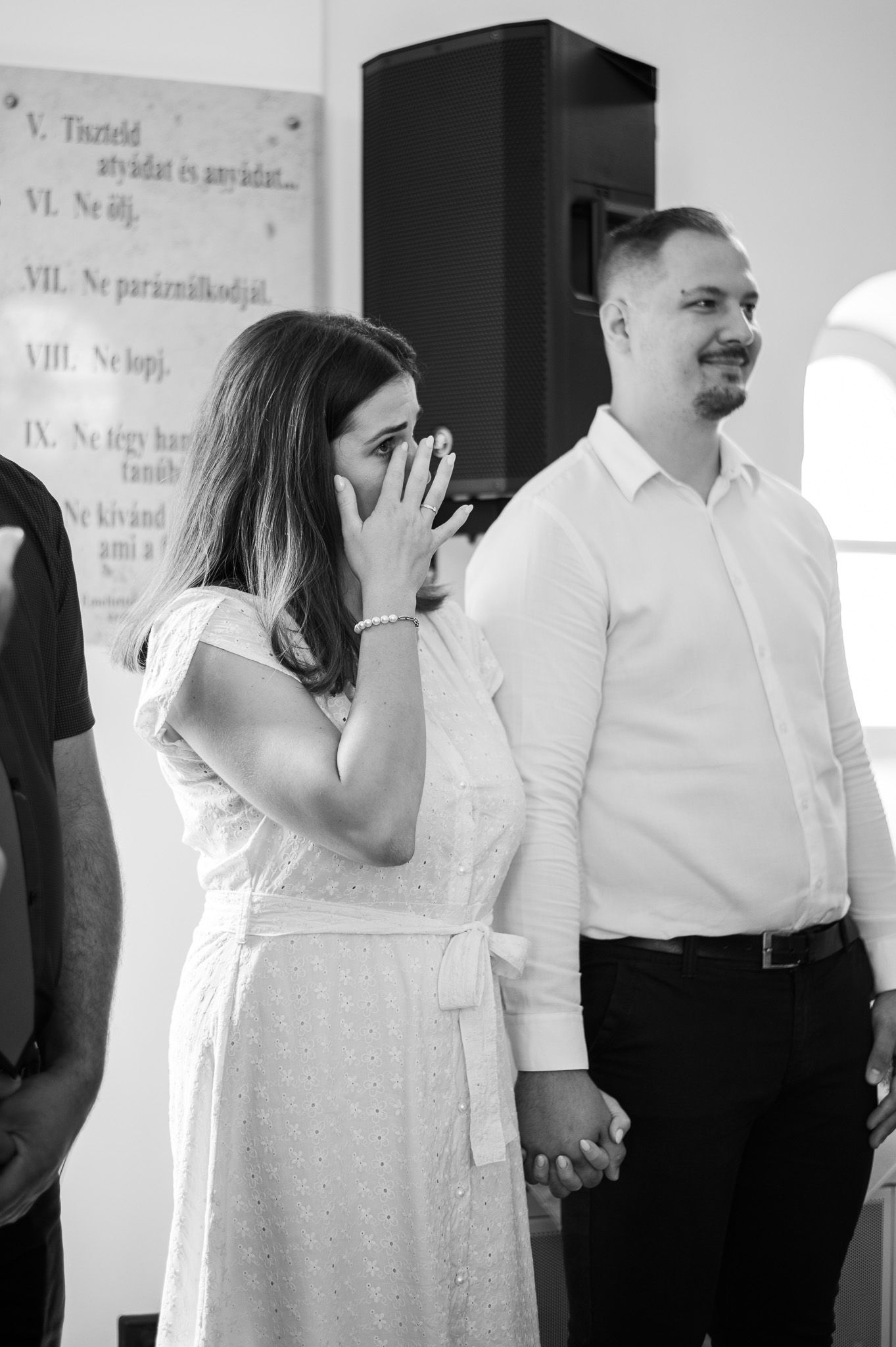 Emotional black and white sequence of a couple during what appears to be a wedding ceremony.