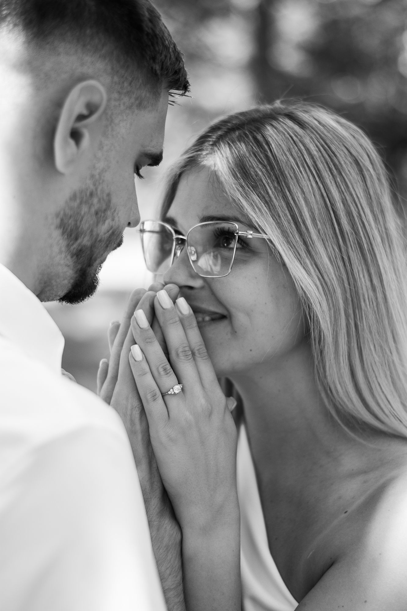 Close-up black and white emotional engagement reaction sequence.
