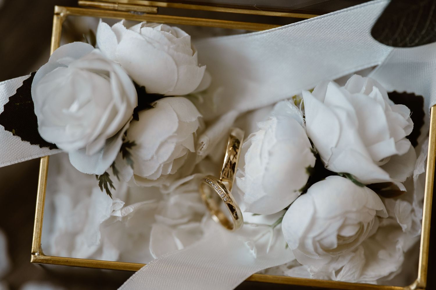 Close-up of delicate white rose petals arranged in an elegant display.