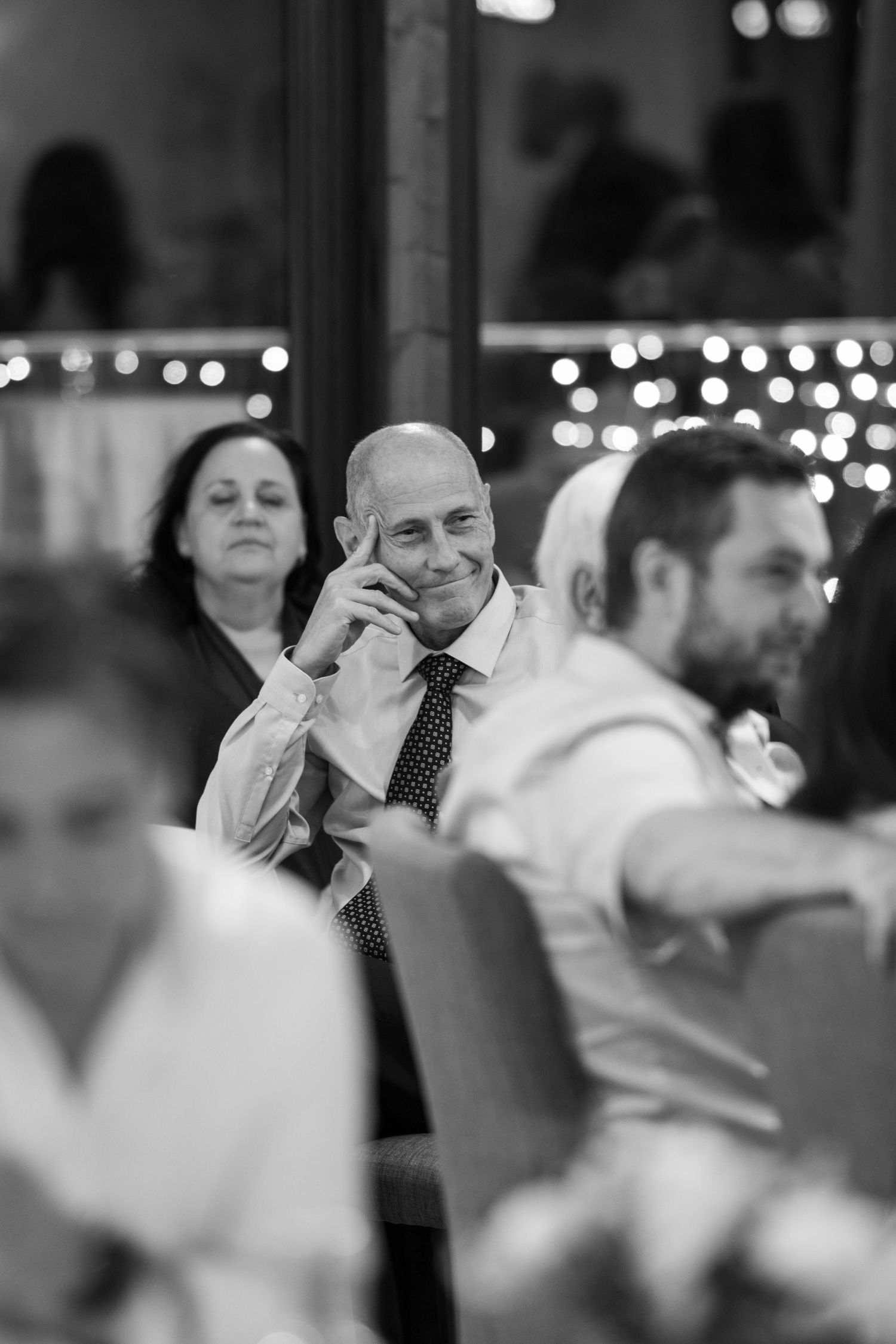 Black and white candid shots of wedding reception dancing and celebrations.