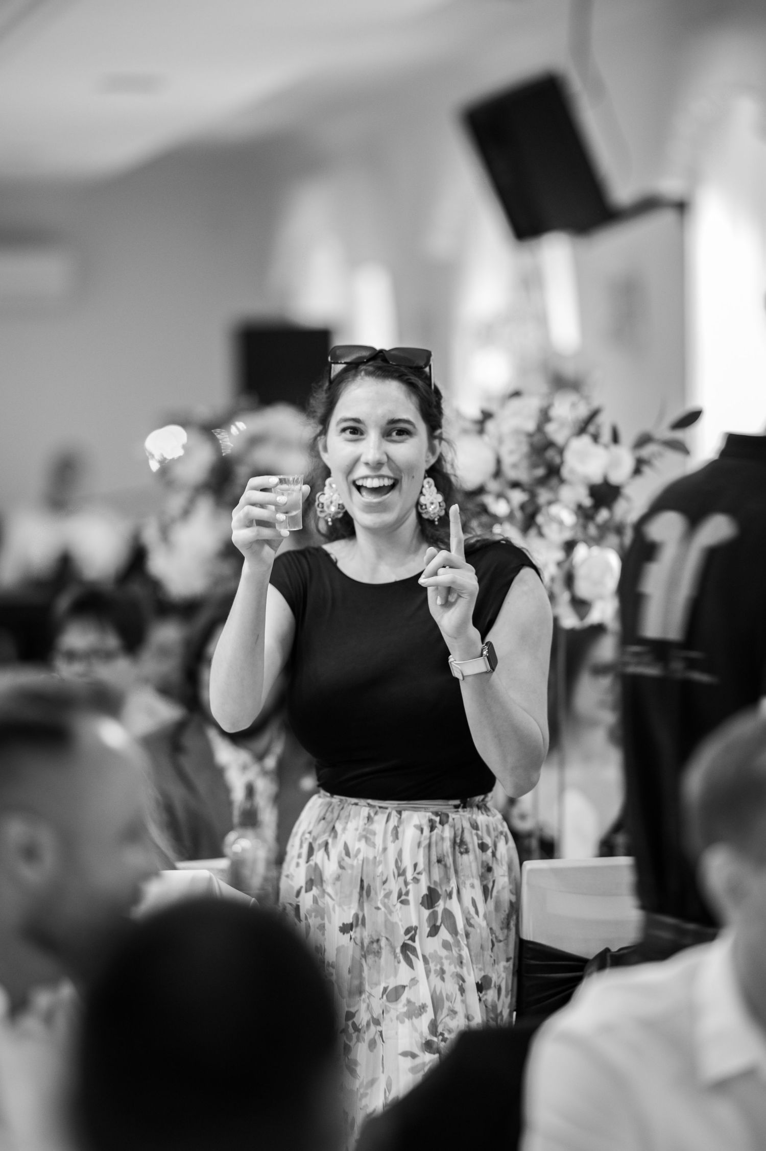 Young guest dances enthusiastically at wedding reception.