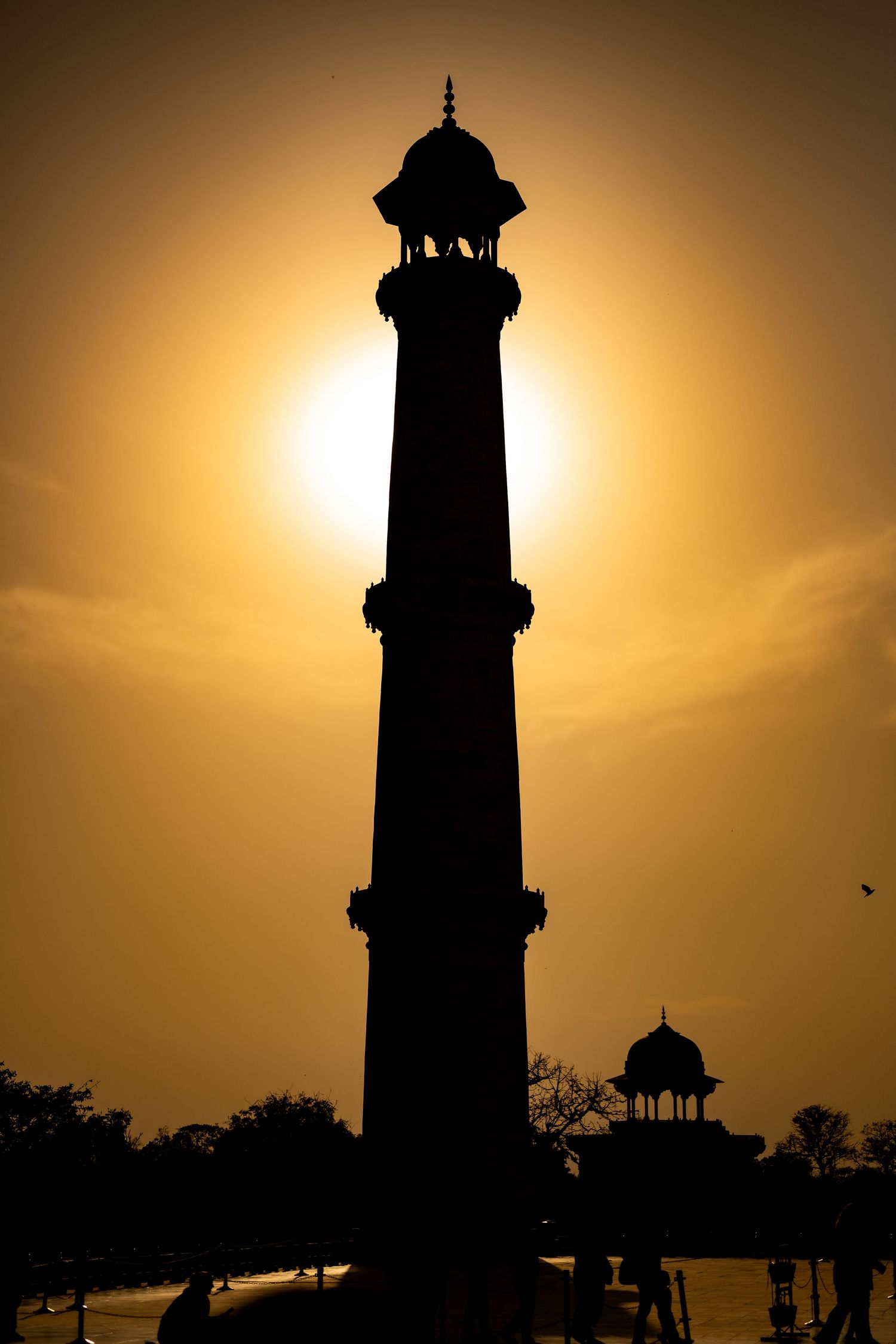 Silhouette of a minaret at the Taj Mahal.