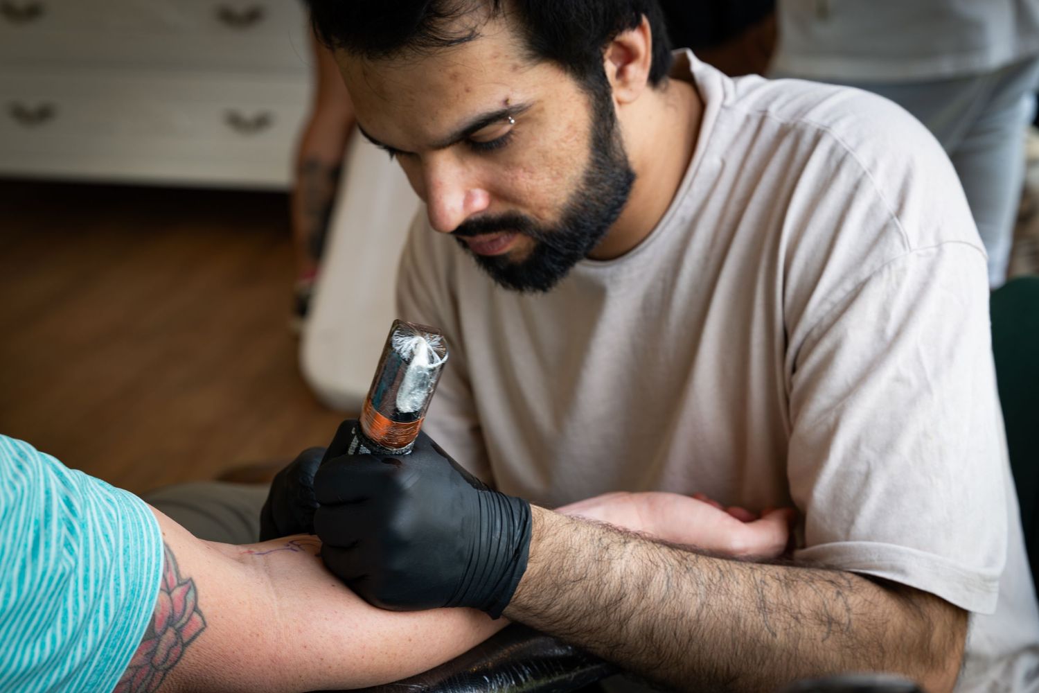Tattoo artist at a studio in Delhi.