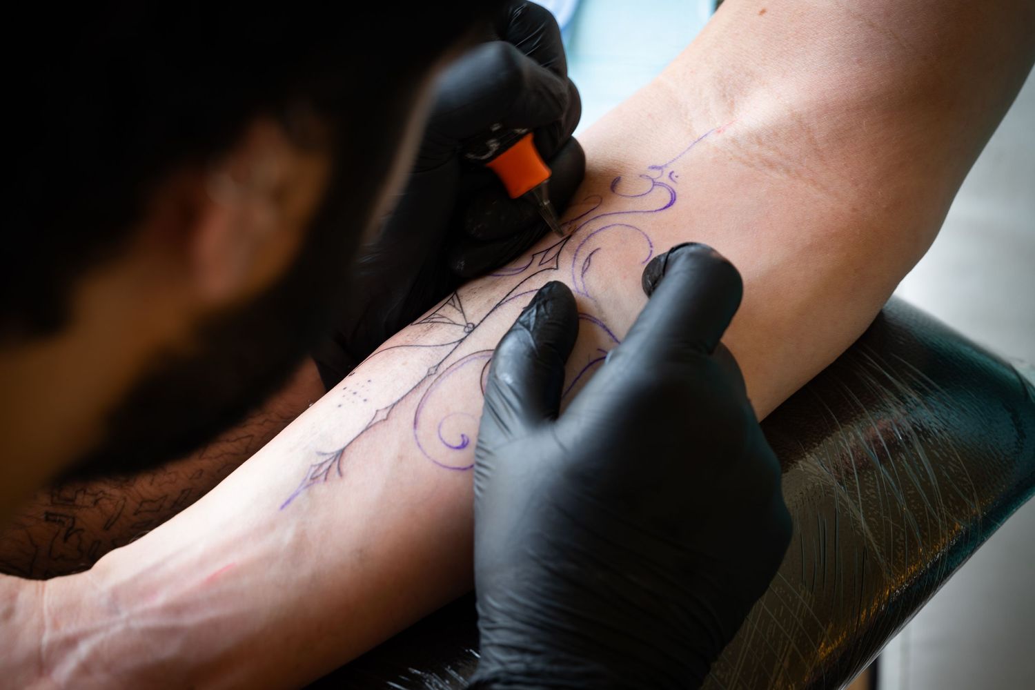 Tattoo artist at a studio in Delhi.
