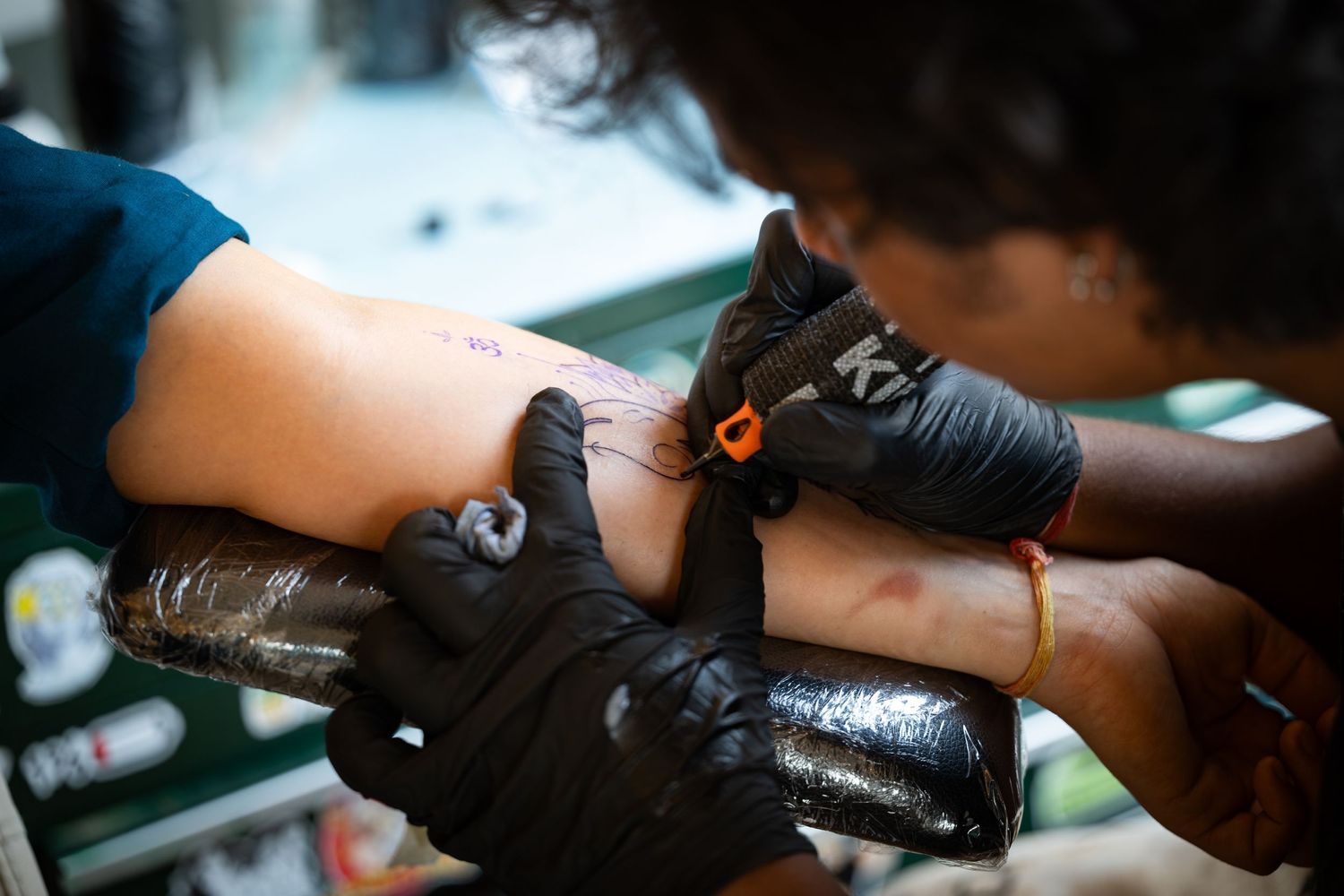 Tattoo artist at a studio in Delhi.