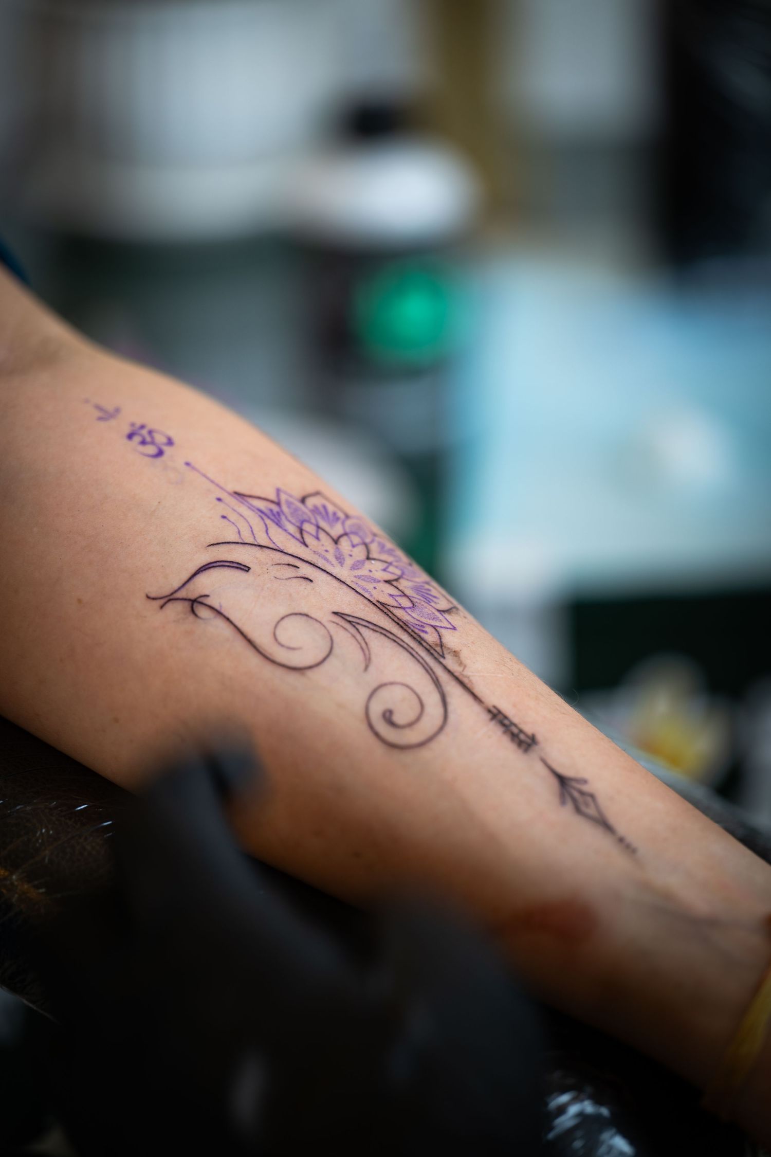 Tattoo artist at a studio in Delhi.