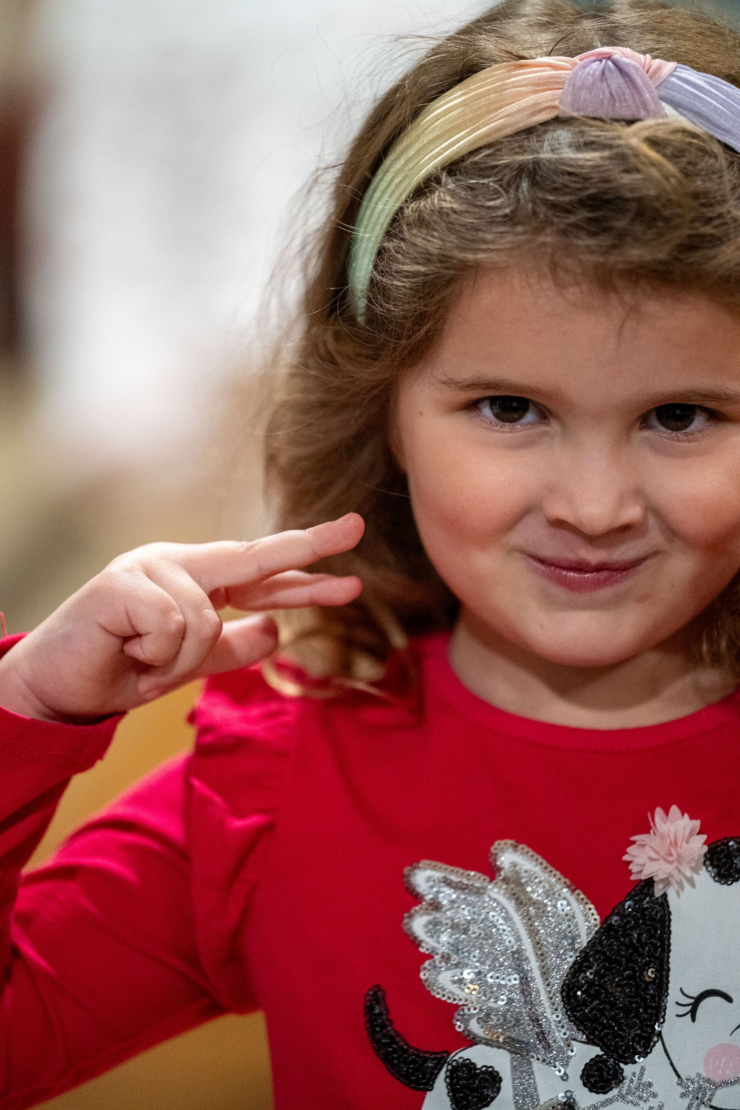 Young girl in red shirt.