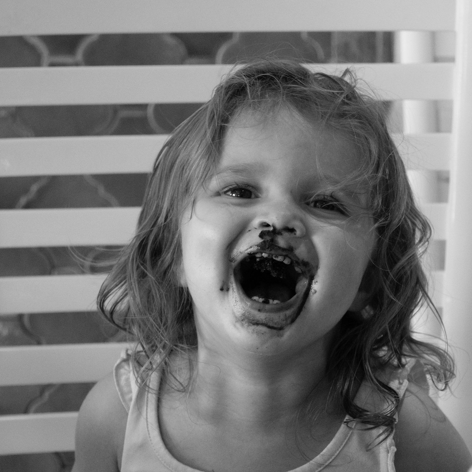 Young child eating chocolate.