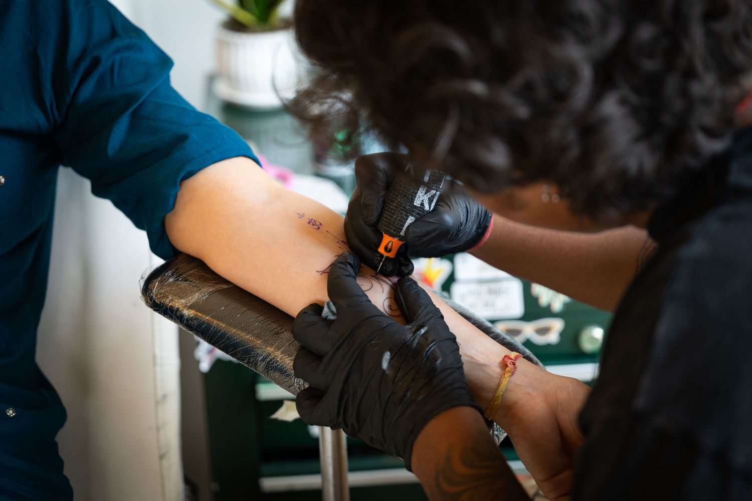 Tattoo artist at a studio in Delhi.