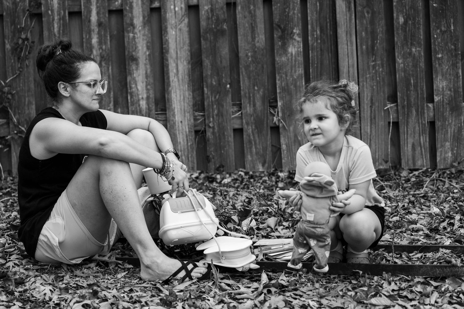 Mother and child sitting outside.