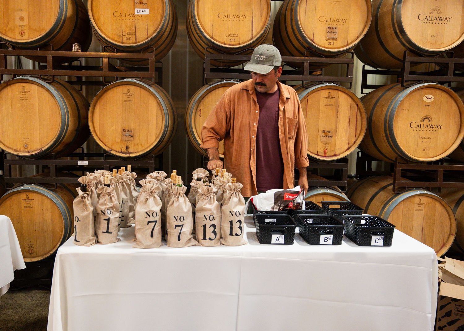 Photo of winery owner at a wine tasting. Photo by Kelly Visel Photography