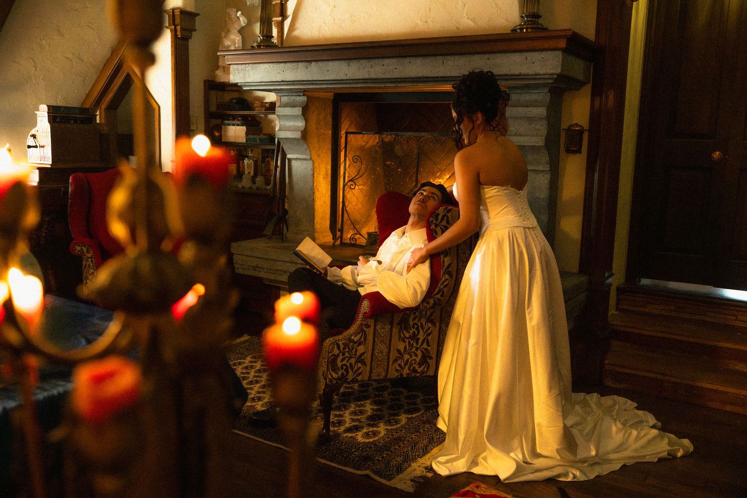 Artistic photo series capturing candlelit moments with a person in white moving through a dimly lit vintage interior.