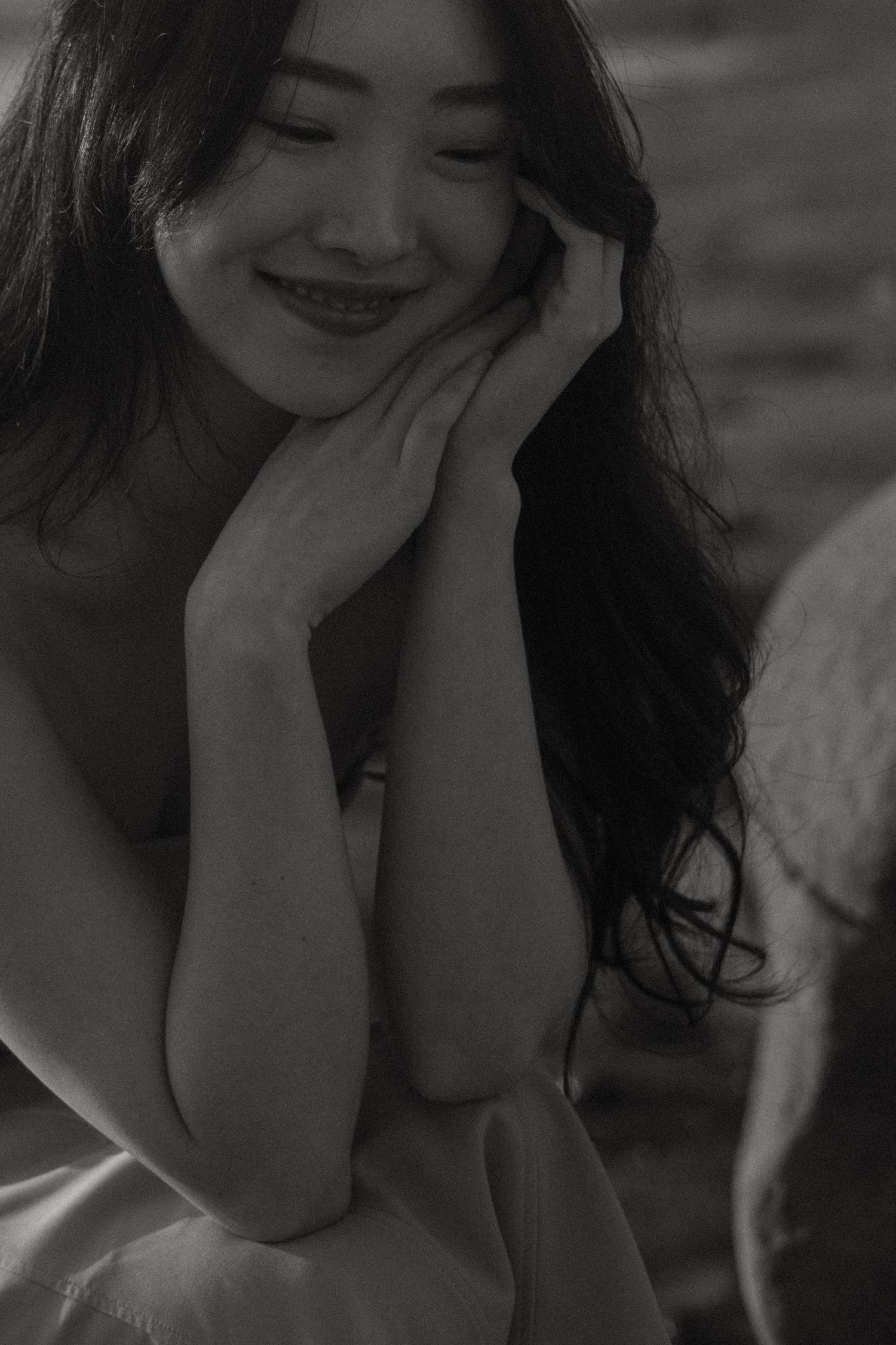 Candid black and white portraits showing joyful expressions and natural lighting.