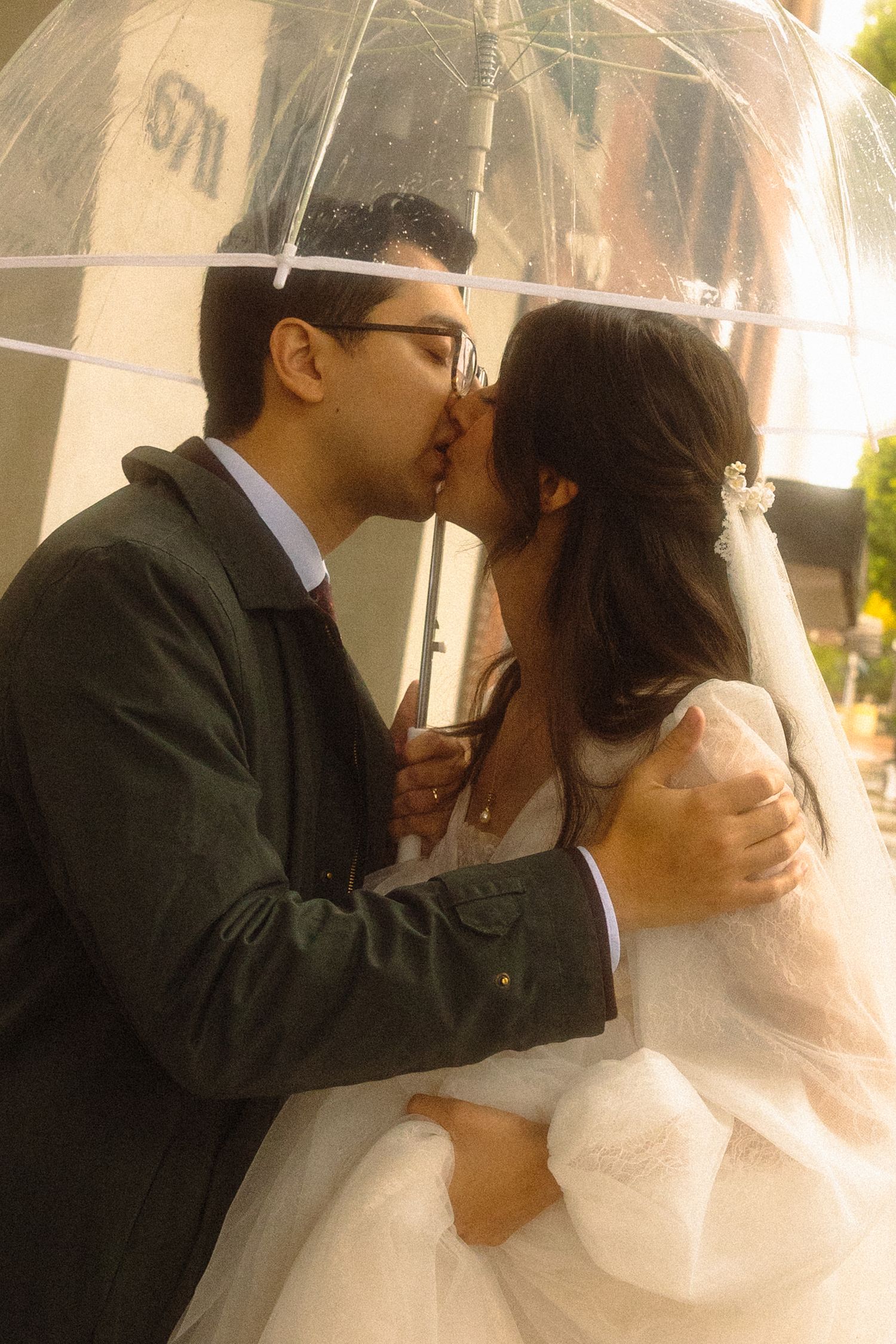 A romantic wedding kiss sequence showing multiple angles of a couple sharing their first kiss as newlyweds.