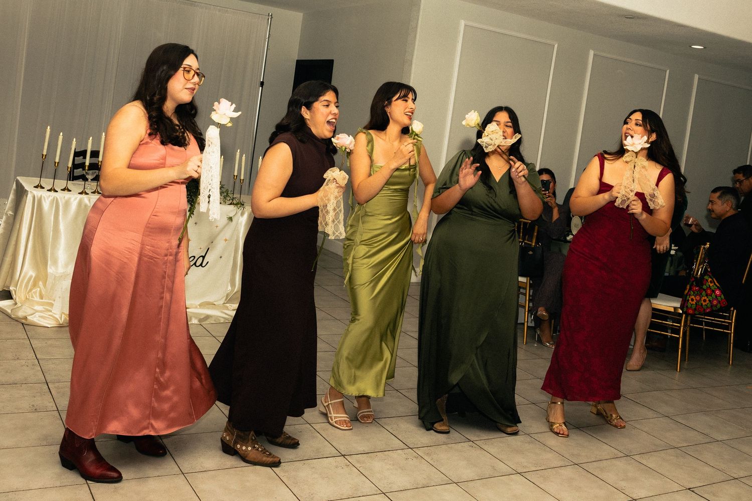 Fashion models pose in a sequence of photos showing different angles and positions during a photoshoot.