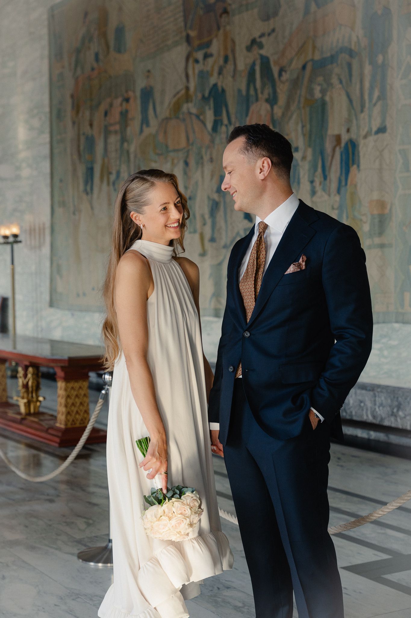 A romantic wedding moment captured in a series of photos showing a couple in formal attire at an elegant venue.