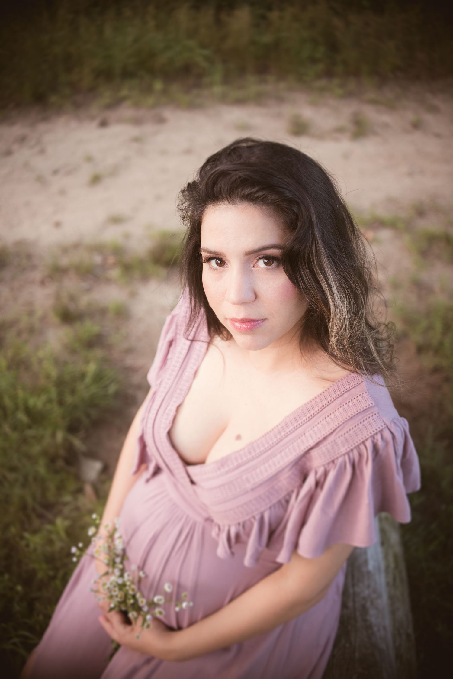 Dreamy portrait session featuring soft pink dress and natural lighting.