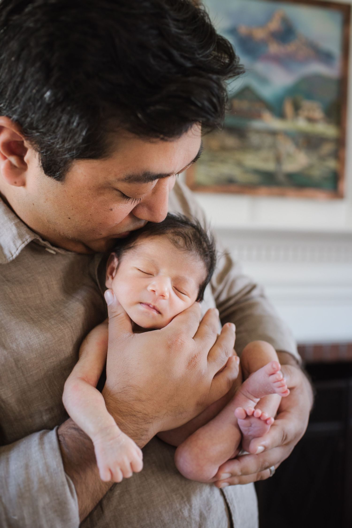 Parent bonding with newborn baby in tender close-up moments.