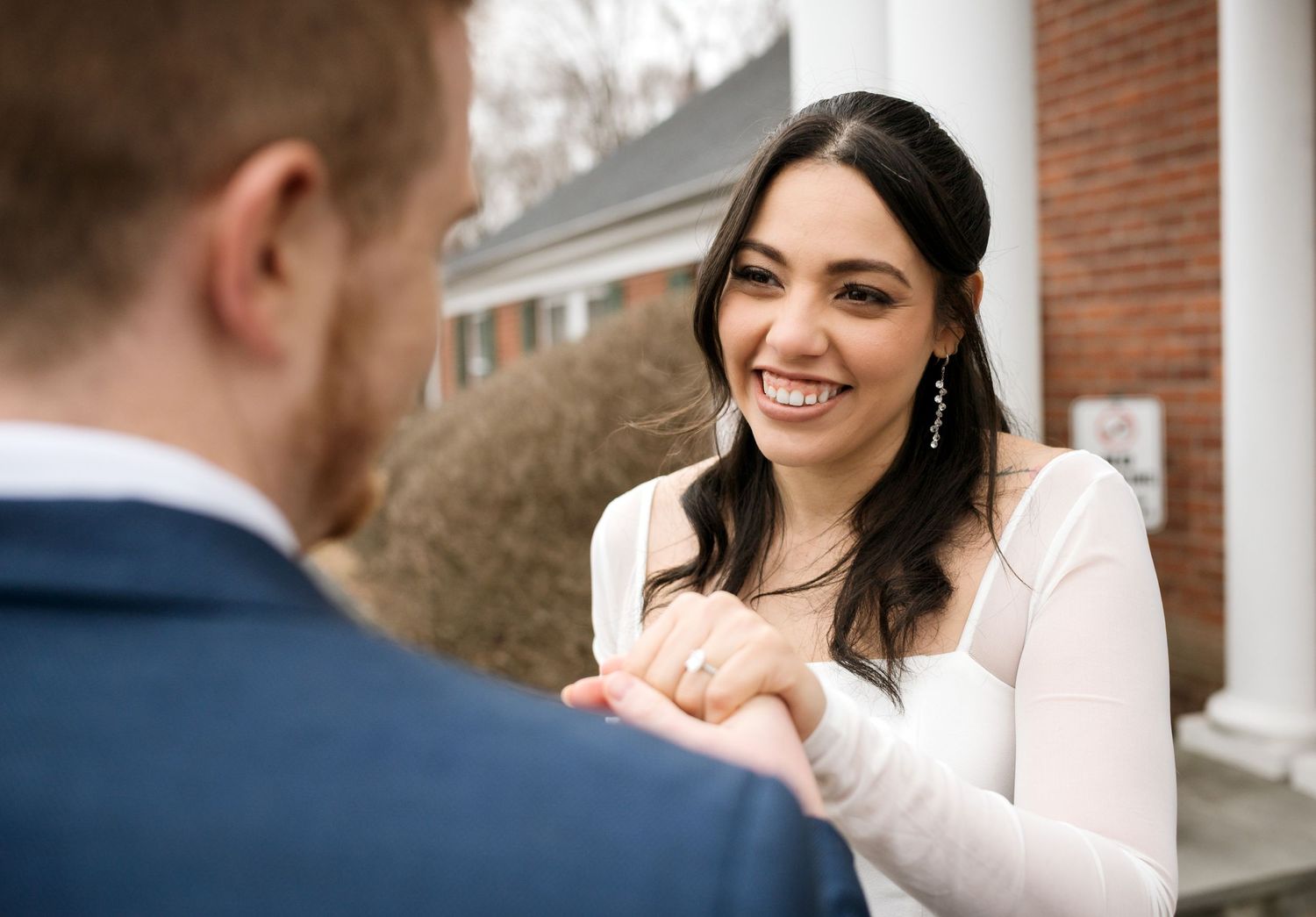 Candid wedding portraits showing joyful moments between newlyweds.