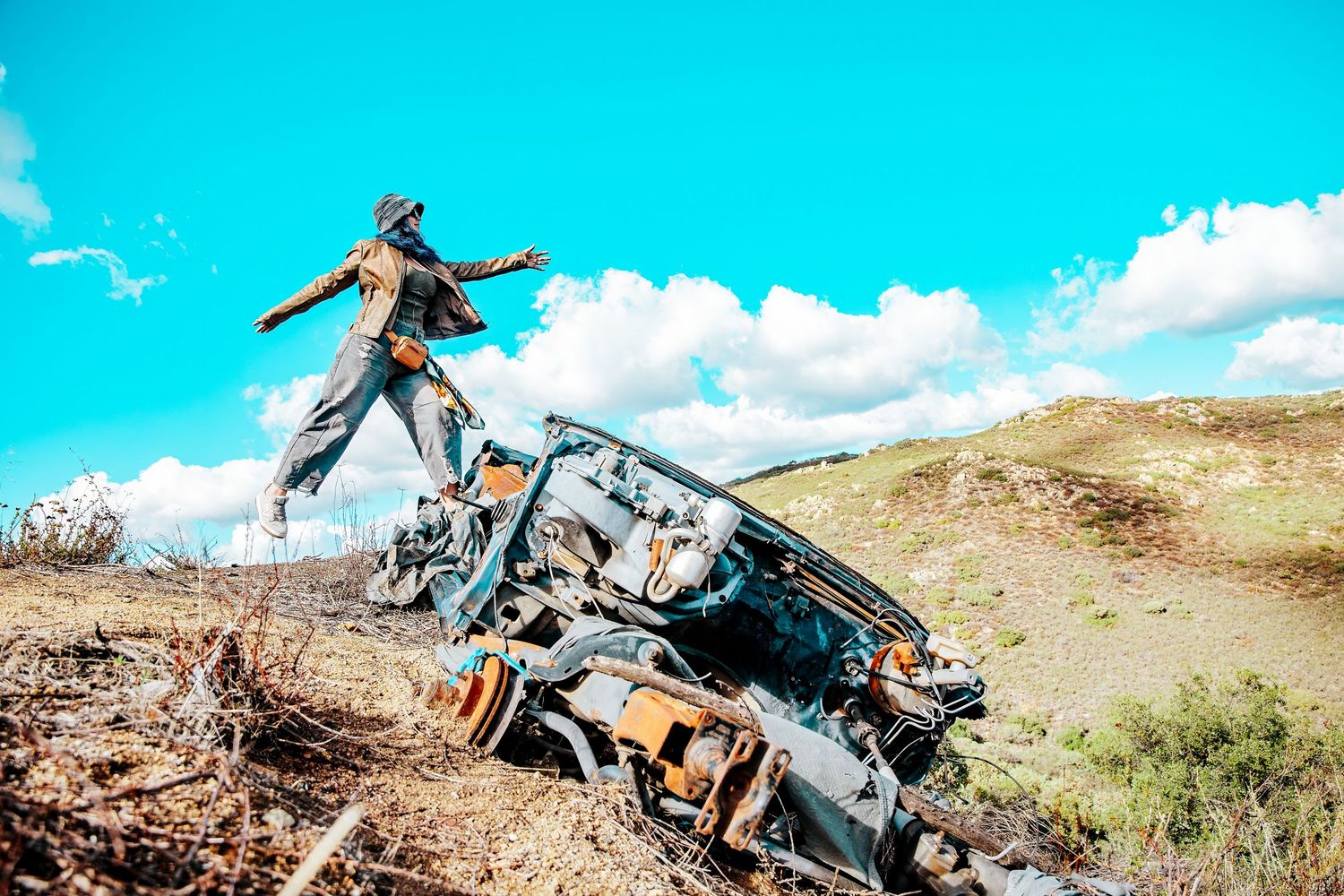 A sequence of action shots showing mountain biking tricks and jumps on a rugged desert trail.