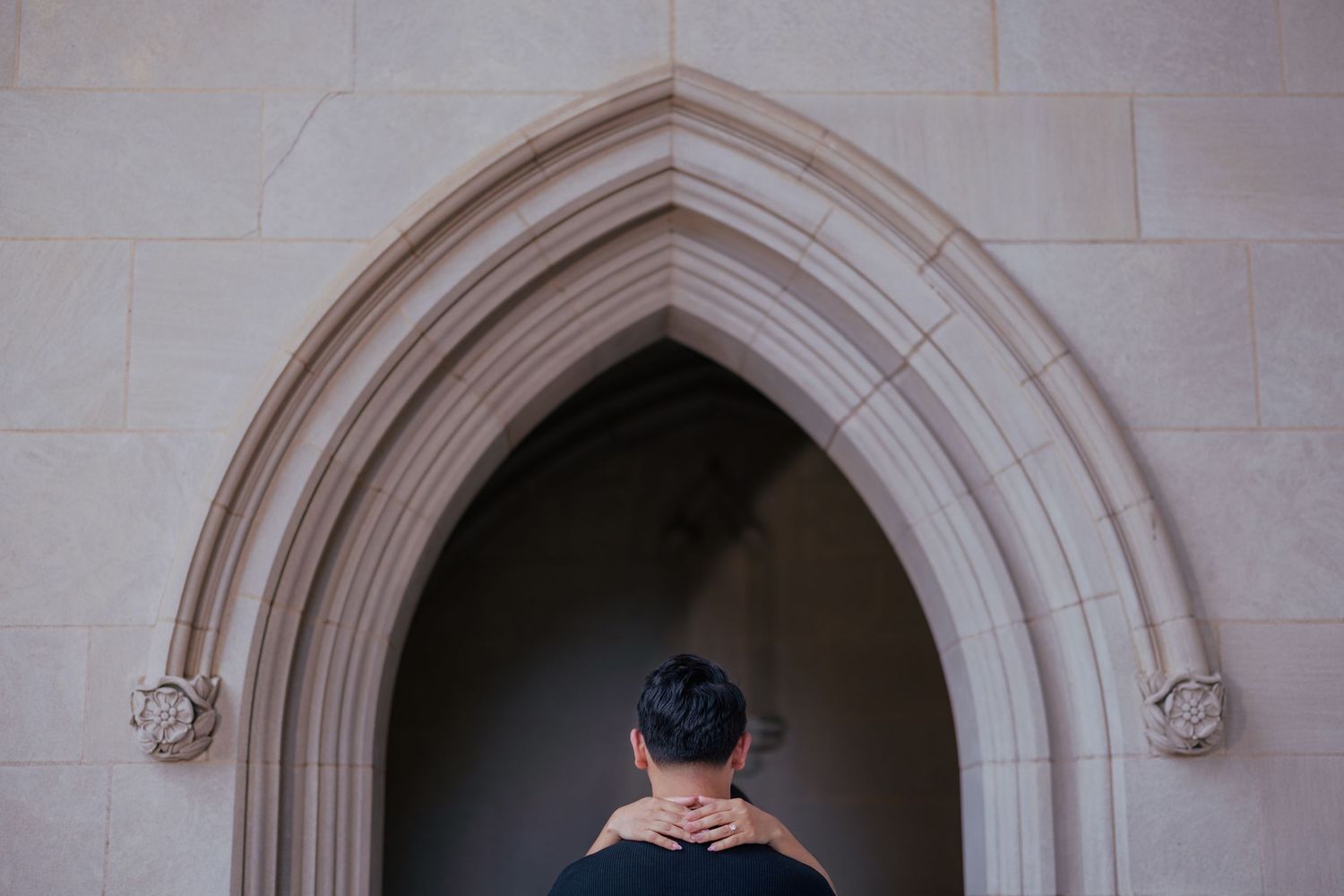 Gothic style stone archway with ornate architectural details and curved molding.