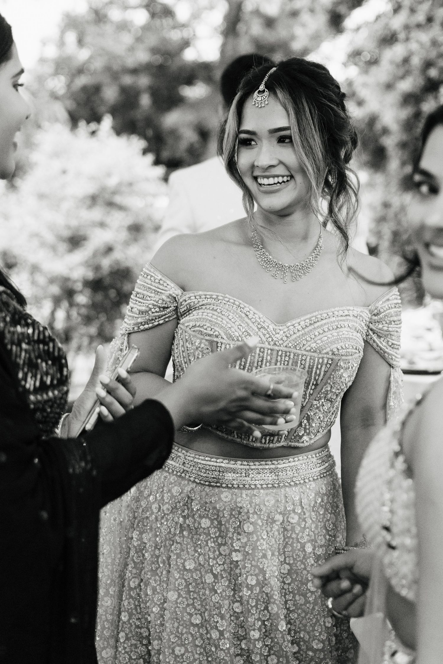 Series of candid moments in a beaded off-shoulder wedding gown outdoors.