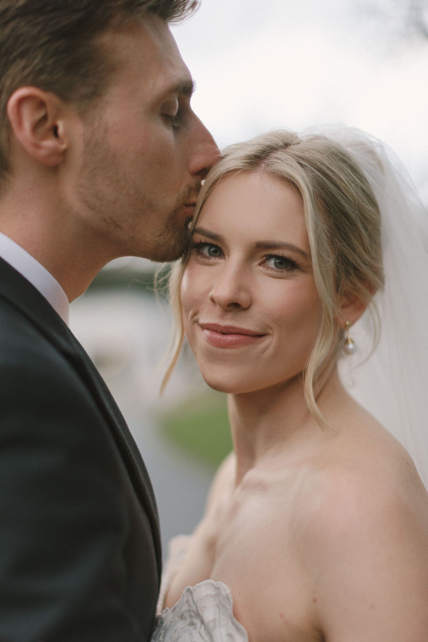 A romantic wedding portrait series showing tender moments between a bride and groom in formal attire.
