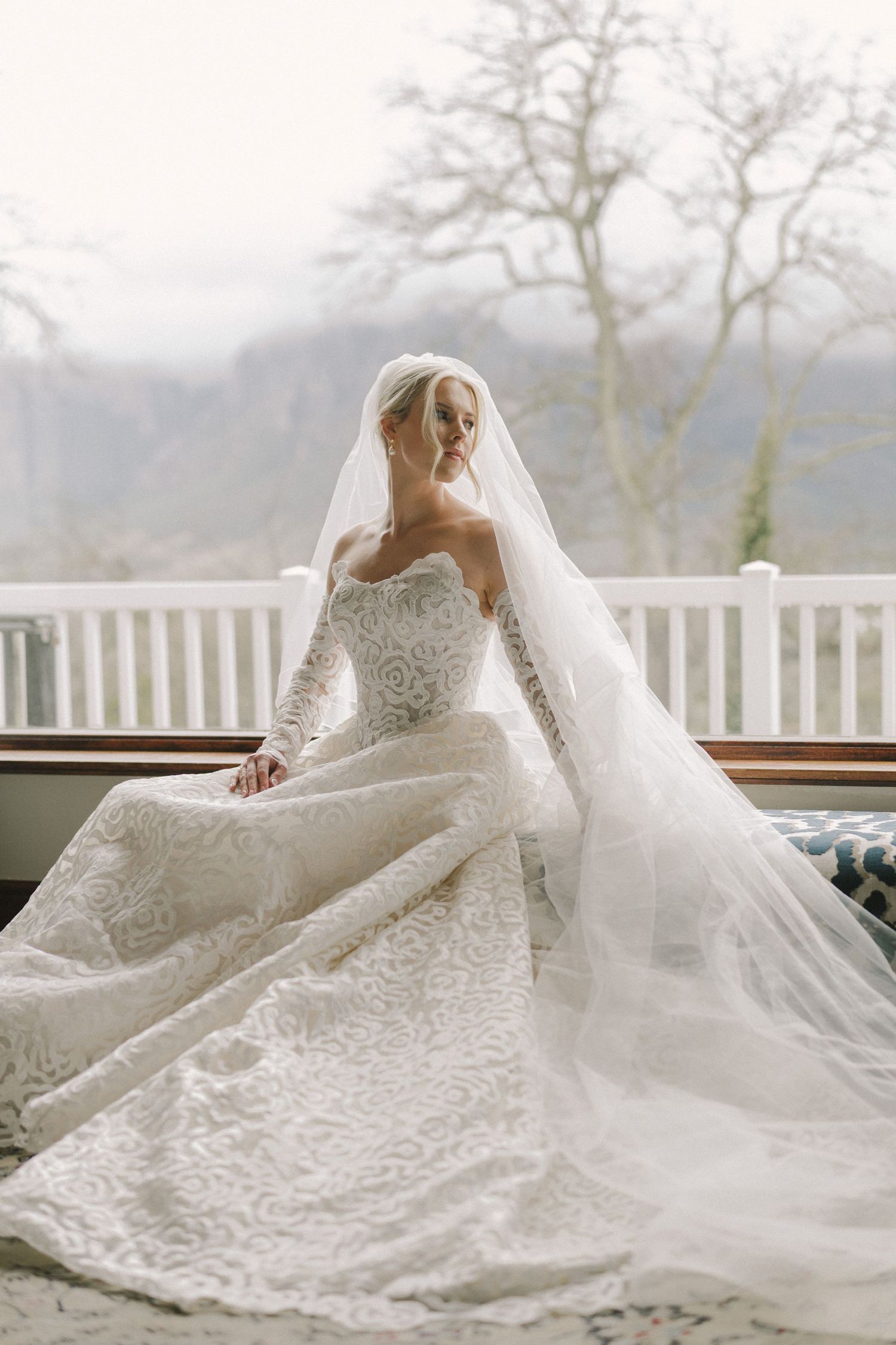 Beautiful wedding dress details captured in sequence showing intricate lace patterns and flowing veils on a balcony.