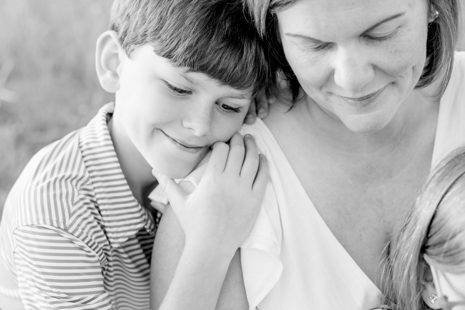 Black and white intimate portrait capturing a tender moment in natural light at Blue Hill Garden in Monroe, NC.
