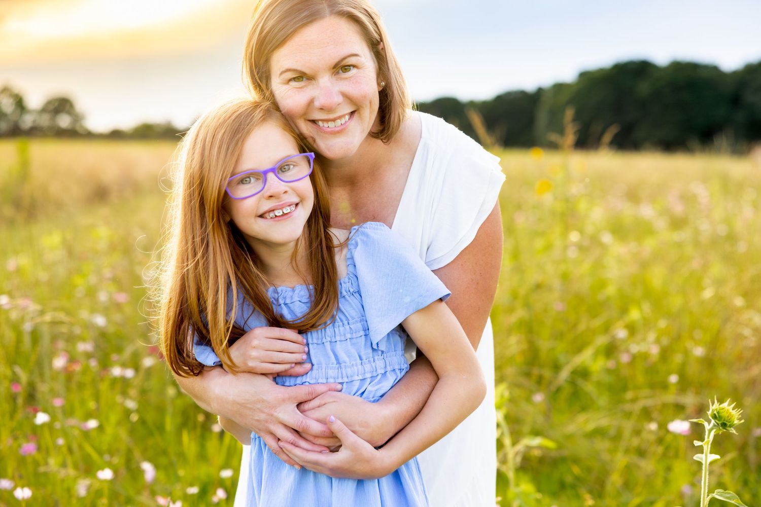 Warm embrace captured during golden hour in a blooming wildflower meadow at Blue Hill Garden in Monroe, NC.