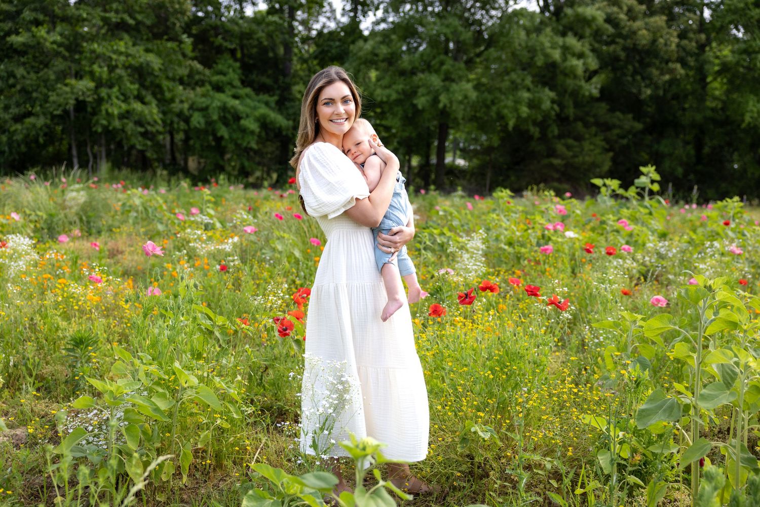 Ethereal portrait in a meadow filled with vibrant poppies and summer wildflowers at Blue Hill Garden in Monroe, NC.