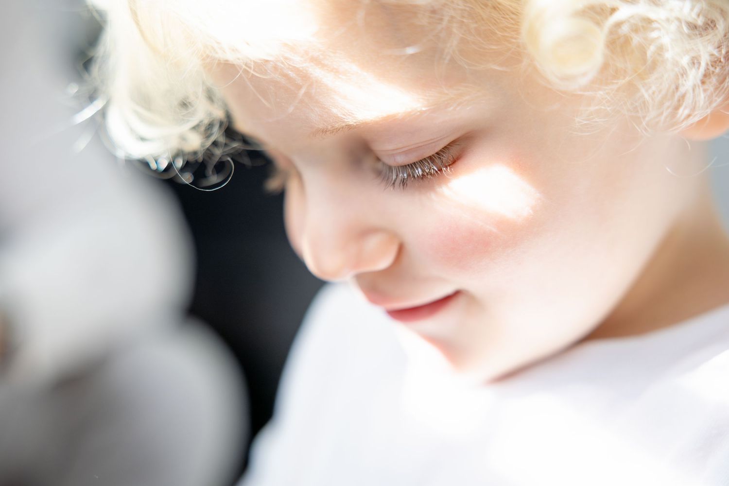Soft ethereal close up portrait with gentle lighting and dreamy atmosphere.