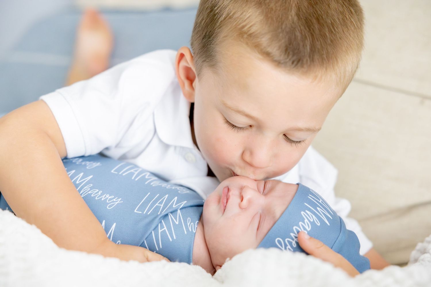 Lifestyle photos showing intimate family moments on white bedding.