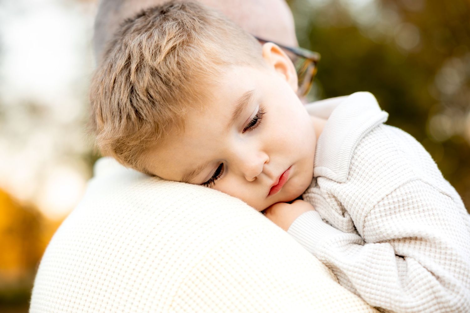 Soft and intimate close-up family portrait moments in cream colored sweaters.