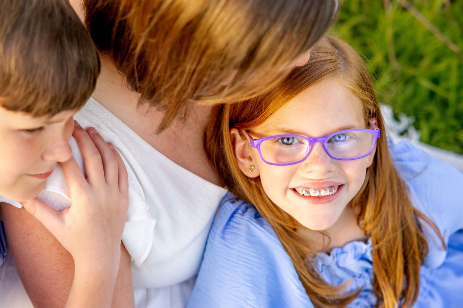 Close up portrait showing genuine laughter and joy during an outdoor photo session at Blue Hill Garden in Monroe, NC.