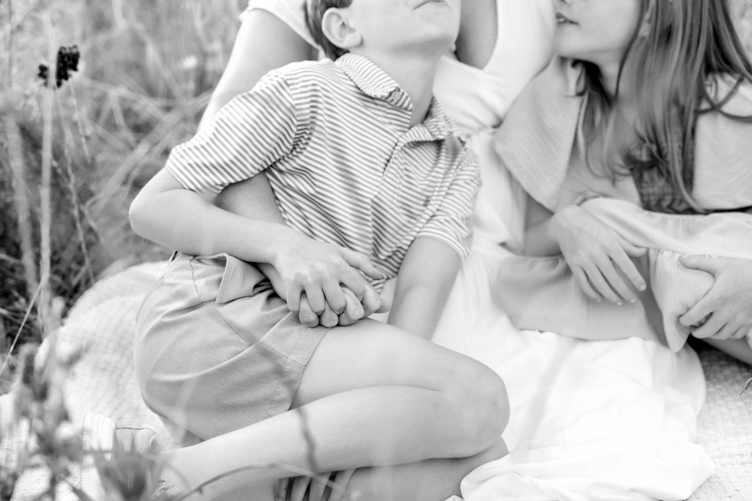 Black and white intimate portrait in natural meadow setting with soft lighting at Blue Hill Garden in Monroe, NC.