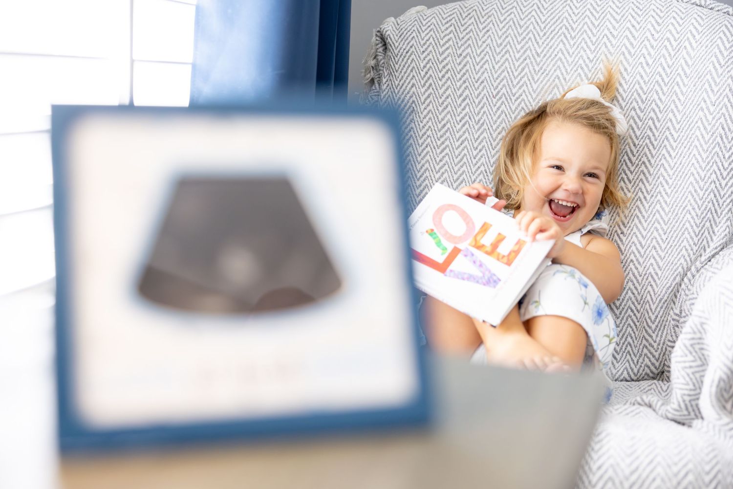 A nursery room decorated in soft blue and white tones with baby accessories and decor items.