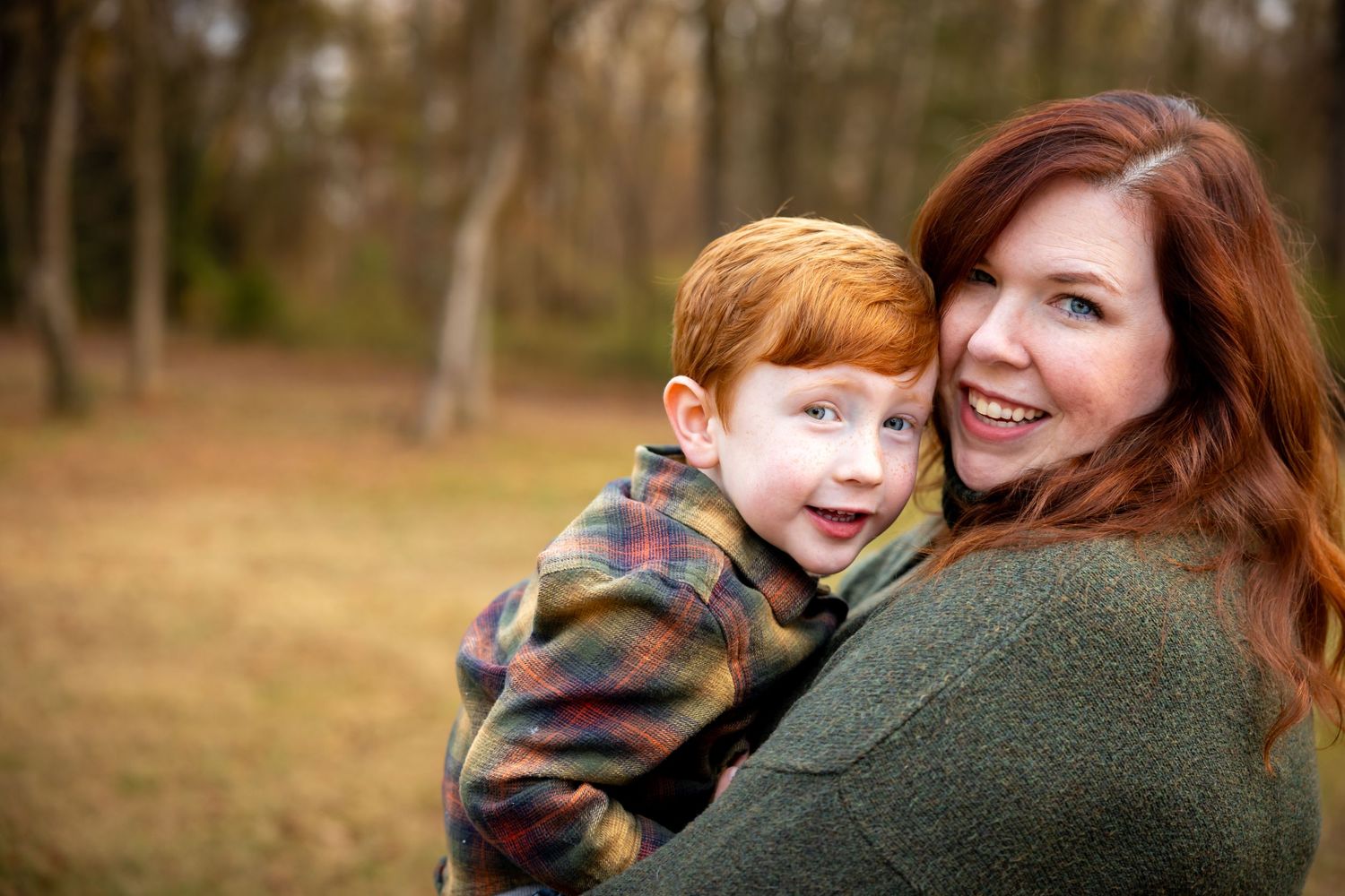 Candid family moments captured in wooded park setting.