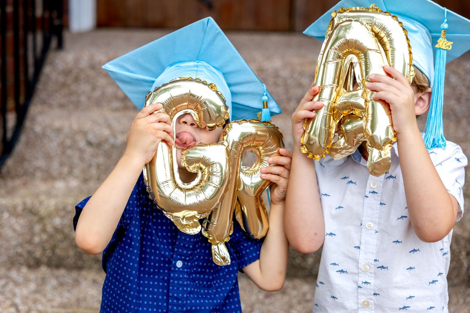 A sequence showing of two preschool graduates playfully posing with gold balloon numbers on concrete steps.
