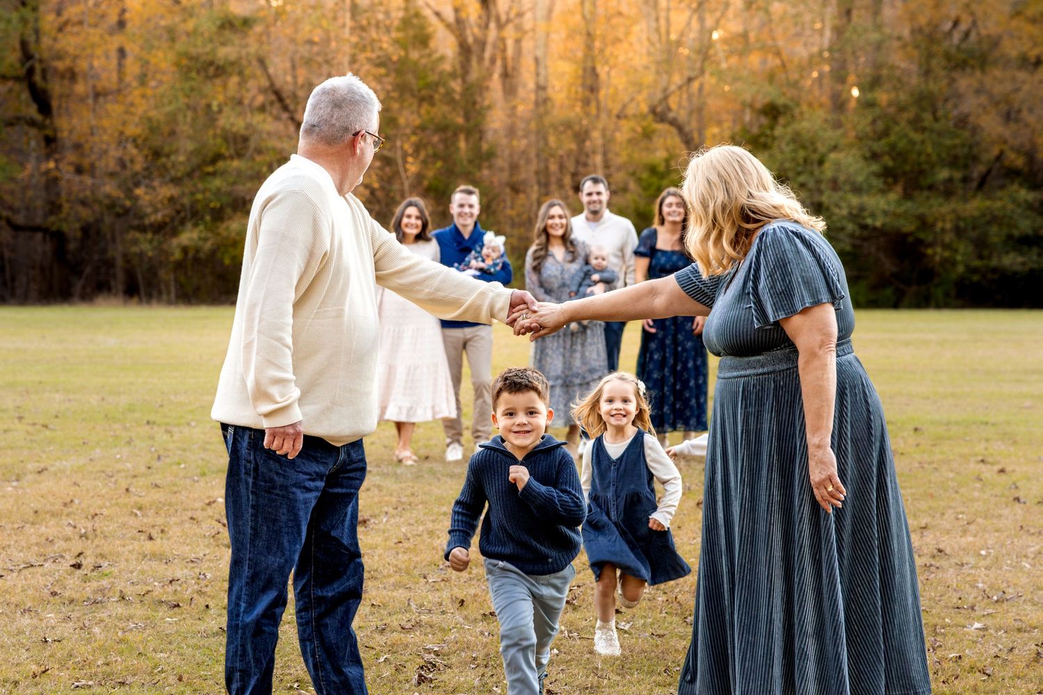 Natural candid moments of family interactions during outdoor photo session.