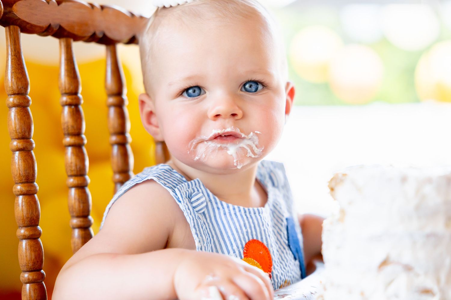 Wooden highchair with water splashing during playtime.