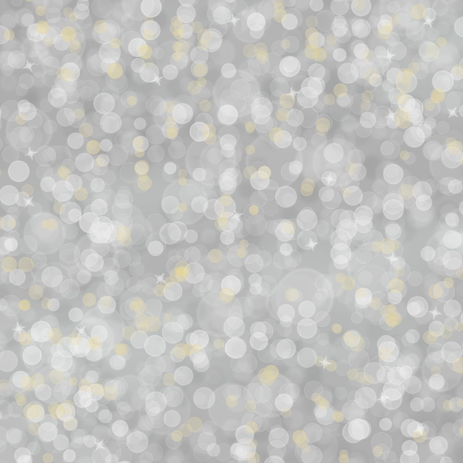 Abstract silver bokeh background with soft glowing circles and golden light spots on gray.