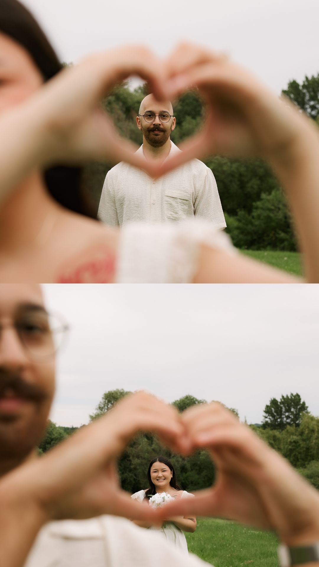 Couple makes heart shape with hands framing each other in outdoor portrait session with green trees background.