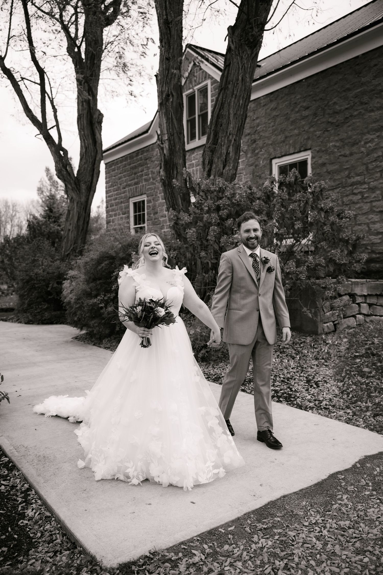 Black and white photo sequence of a couple posing playfully on outdoor stone steps.