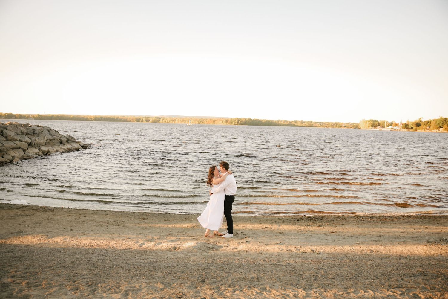 Romantic beach photoshoot sequence with couple walking along shoreline at sunset.